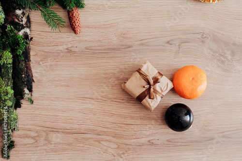 Christmas Tree Branches and on a Wooden Background with Copy Space