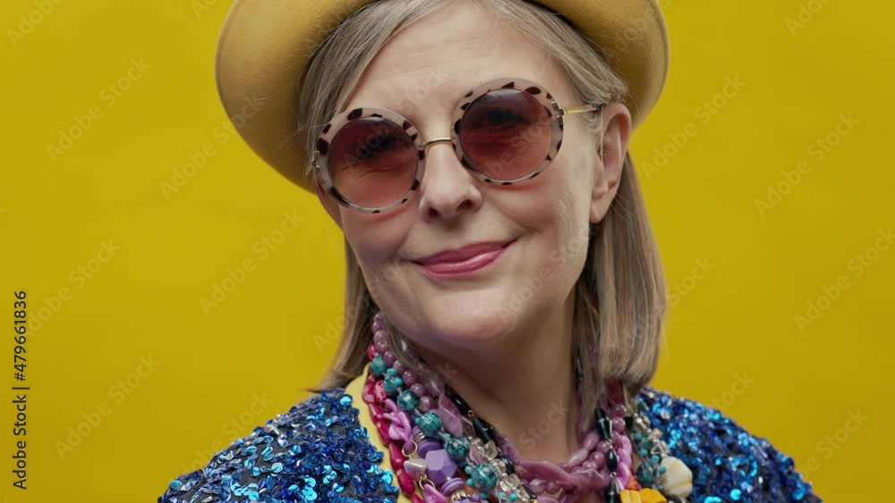 Portret Of Elderly Woman On Yellow Background. Portret Of Elderly Woman On Yellow Background.