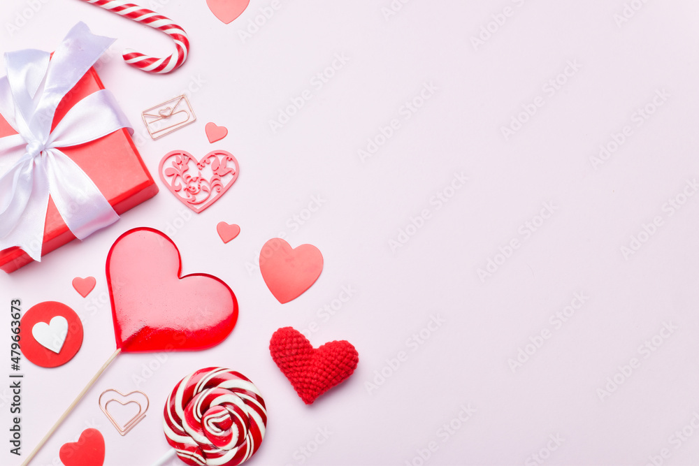 Background for Valentine's Day. The banner is festive. Lollipops, a gift and hearts on a pink background.