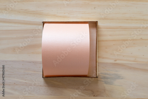 pink paper inside a wooden box