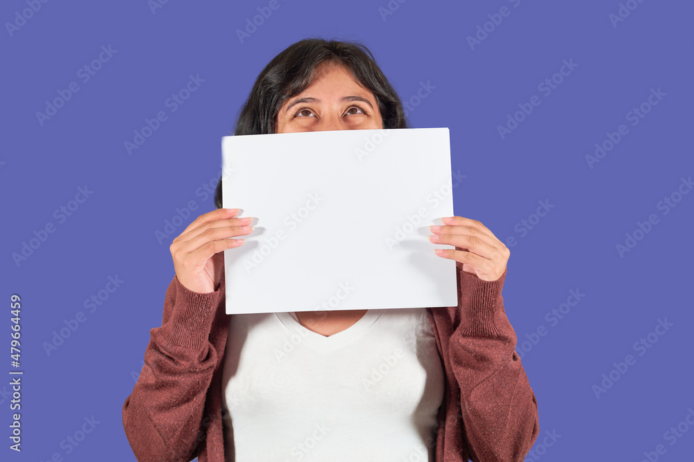Happy latin young woman showing blank advertisement. Isolated Happy latin young woman showing blank advertisement. Isolated
