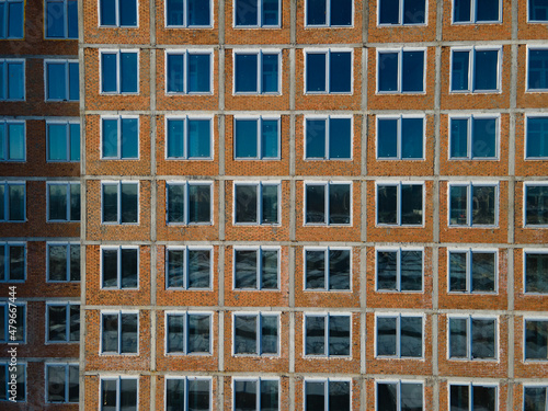 Aerial view from a drone to a pattern from the windows of an unfinished building