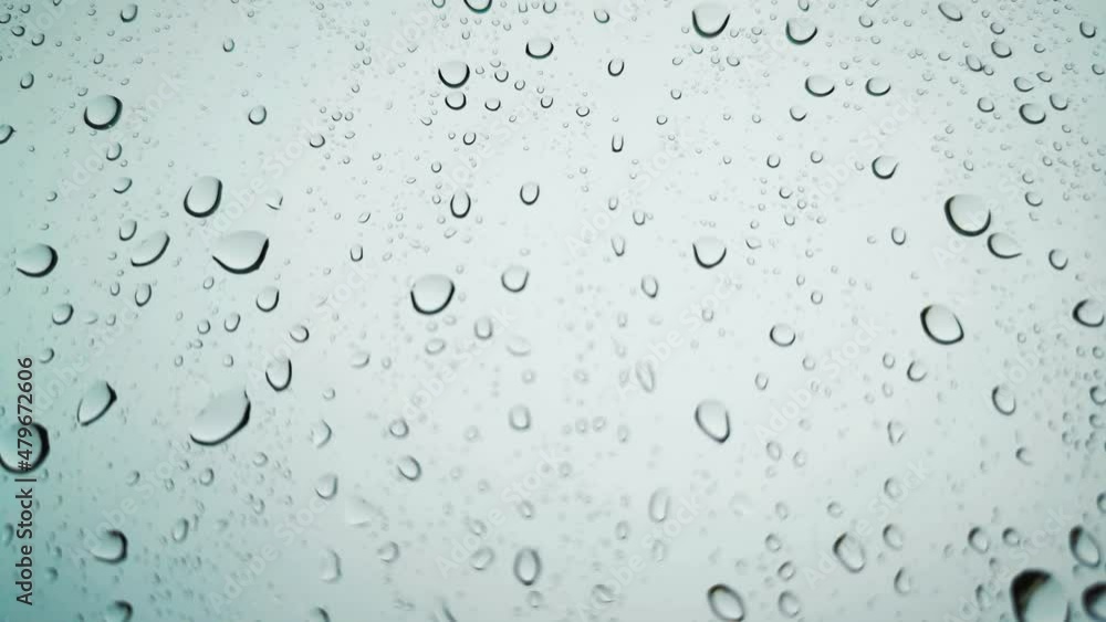 Rainwater drops Falling Down On the Window Glass, Rain Drops On The Windows Glass, Macro shot of water droplets falling.soft focus.shallow focus effect.
Rainwater drops Falling Down On the Window Glass, Rain Drops On The Windows Glass, Macro shot of water droplets falling.soft focus.shallow focus effect.