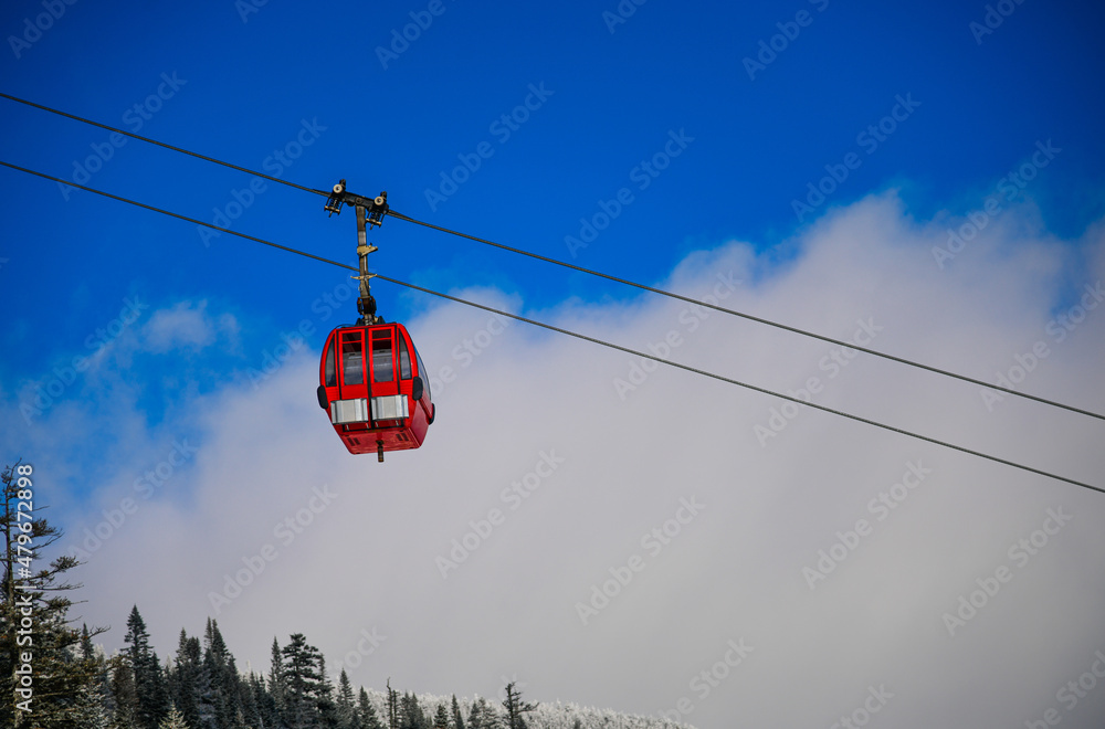 Easy way Gondola lift at Ski Resort. Beautiful winter sunny day.