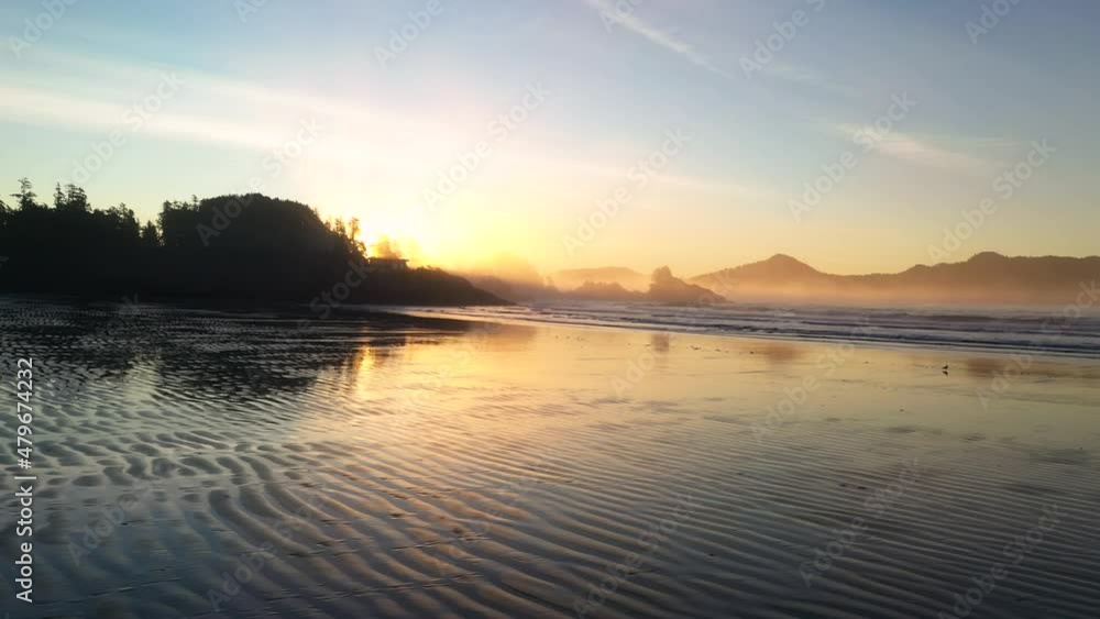 Sunrise At The Beach Reflecting In The Sand Sunrise At The Beach Reflecting In The Sand