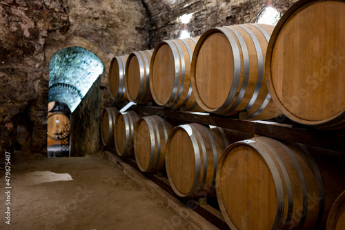 Bild auf Leinwand Medieval underground wine cellars with old red wine barrels for aging of vino no