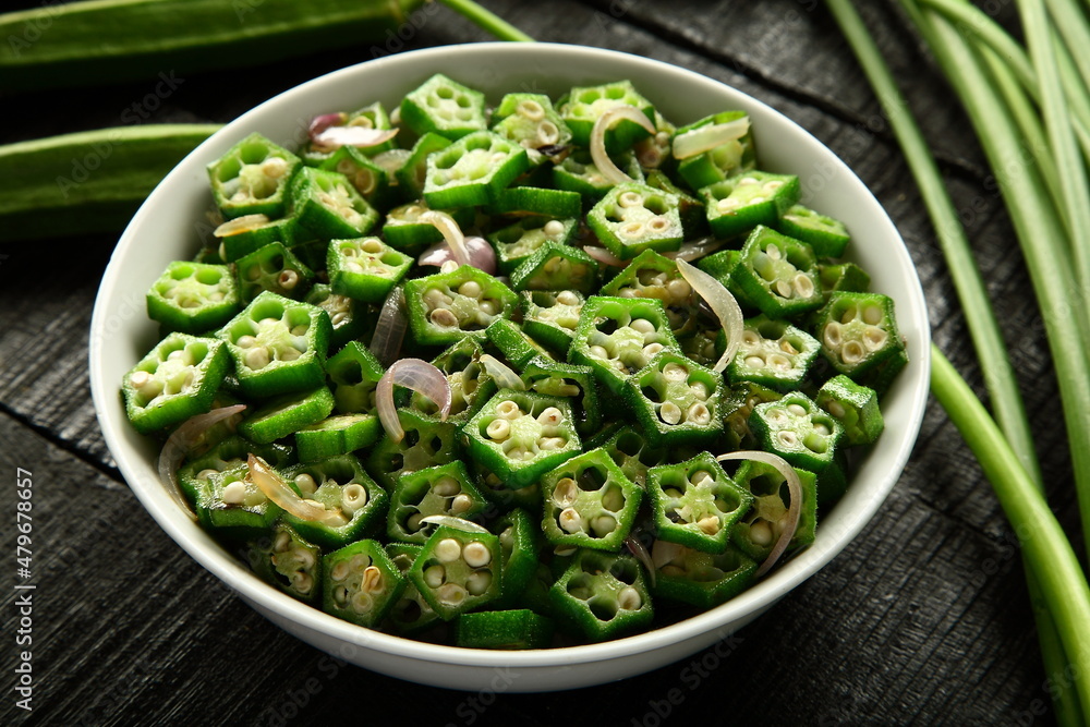 Delicious vegan curry dish- stir fried organic okra with herbs and spices. Delicious vegan curry dish- stir fried organic okra with herbs and spices.