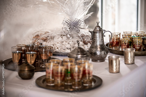 Traditional Morrocan tea pot and tea glasses, with orential pastries, for a wedding