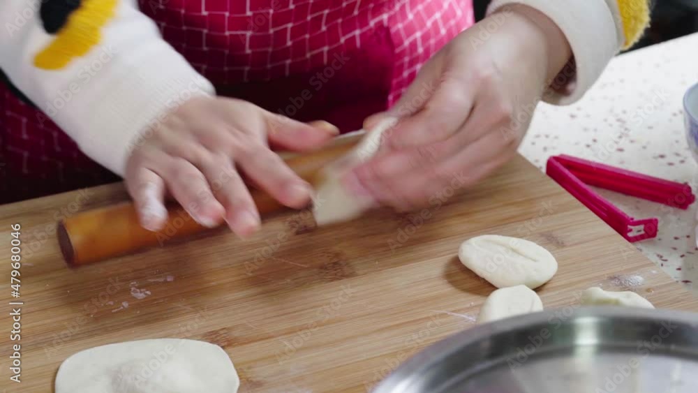 A chef is making buns by hand A chef is making buns by hand