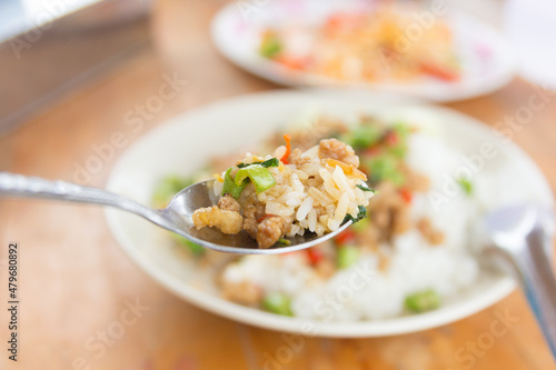 Rice topped with stir-fried pork and basil