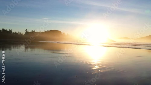 Sunrise Reflections On A Beach With Waves