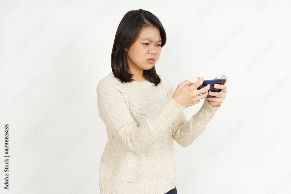 Play Game on Smartphone of Beautiful Asian Woman Isolated On White Background Play Game on Smartphone of Beautiful Asian Woman Isolated On White Background