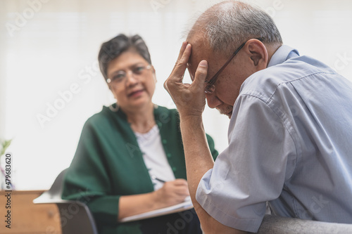 Psychology, depression people. Elderly asian adult man, men consulting with psychologist ,psychiatrist while elderly, old patient counseling mental with doctor woman at clinic. Encouraging, therapy.