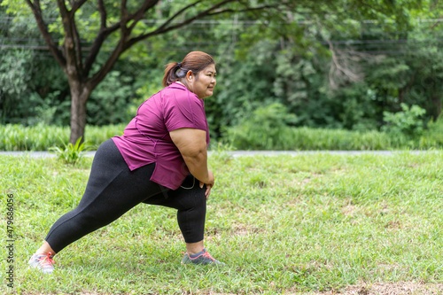 Asian fat woman workout outdoors exercising in park, Sport and recreation for weight loss idea concept.