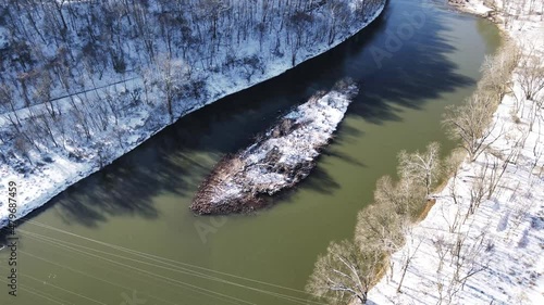 Circle around river island snow covered