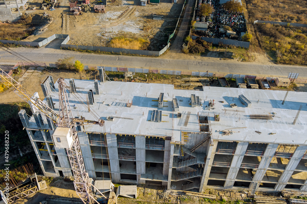 Aerial view a concrete multi-story modern residential under construction building