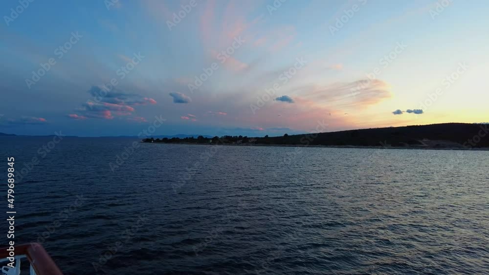 A beautiful view of the Dusk landscape horizon with sea and colorful clouds in the background. Ferry sailing from Split to island Vis in Croatia, Adriatic Sea 4K A beautiful view of the Dusk landscape horizon with sea and colorful clouds in the background. Ferry sailing from Split to island Vis in Croatia, Adriatic Sea 4K