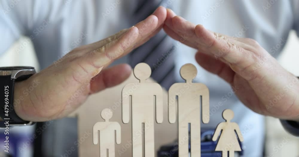Male hands protecting wooden figurines of lgbt family closeup 4k movie slow motion Male hands protecting wooden figurines of lgbt family closeup 4k movie slow motion