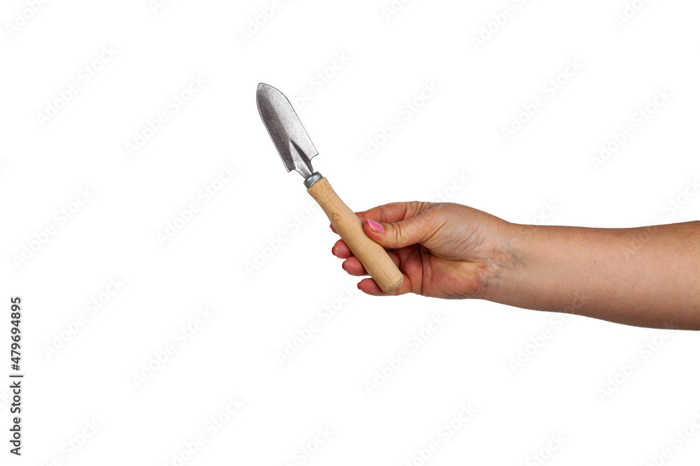 Female hand holds scoops for plant care Female hand holds scoops for plant care