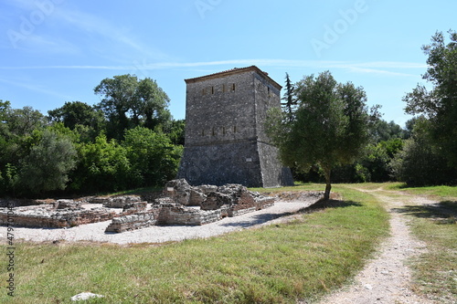 Venetian Tower and thermal baths in the ruined city, archaeological site in Butrinti Albania photo