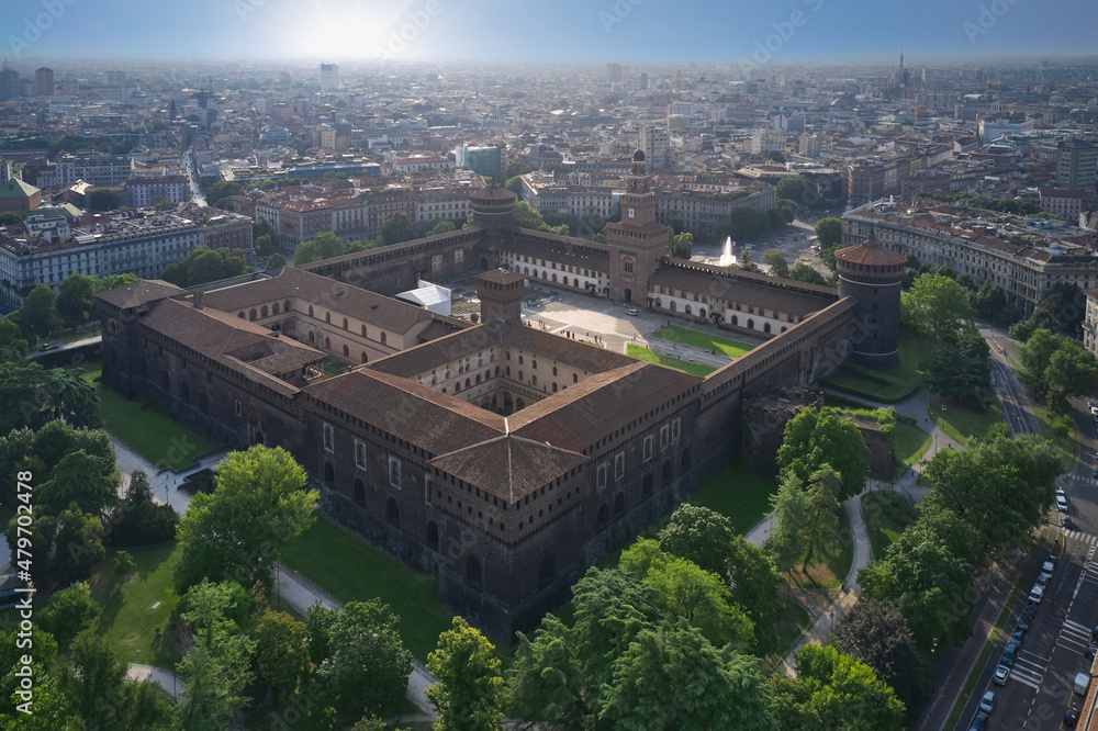 Castello Sforzesco morning sunrise aerial view. The main Italian castle in Milan. The residence of the dukes of Milan of the Sforza dynasty in Milan. Top view of the Sforzesco castle in Milan Italy.