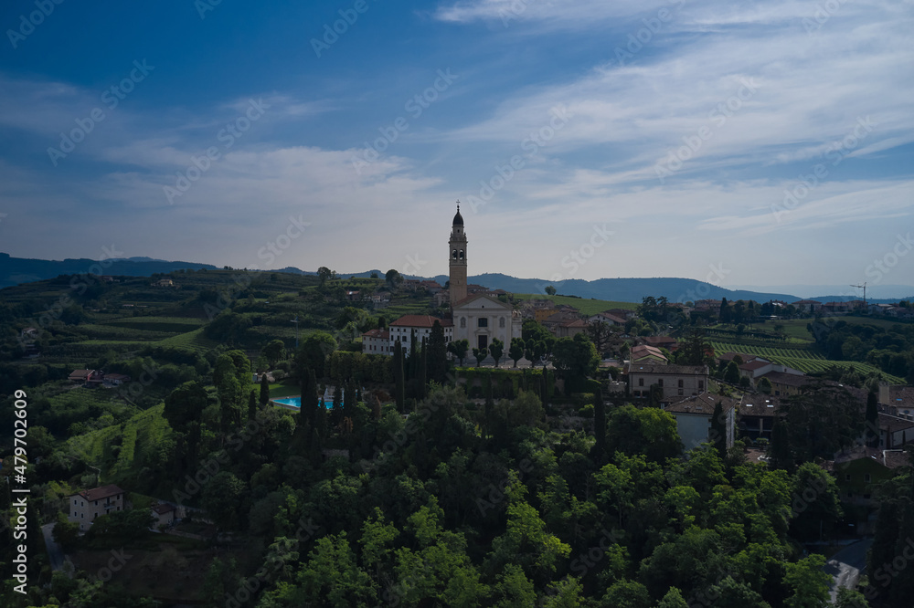 Parish Church of Saints Fermo and Rustico, on a hill in the province of Verona, Colognola Ai Colli, Italy. Catholic church on a hill surrounded by vineyards. Italian historic town on a hill.