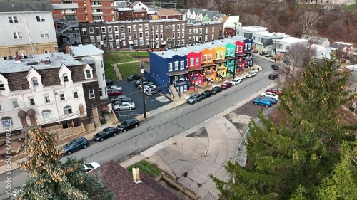 Aerial approach of colorful homes in American city during drab winter scene. Splash of color on houses. photo