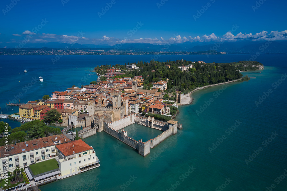 Aerial photography with drone. Aerial view on Sirmione sul Garda. Italy, Lombardy.  Rocca Scaligera Castle in Sirmione.