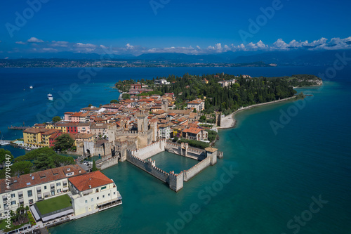 Aerial photography with drone. Aerial view on Sirmione sul Garda. Italy, Lombardy. Rocca Scaligera Castle in Sirmione.