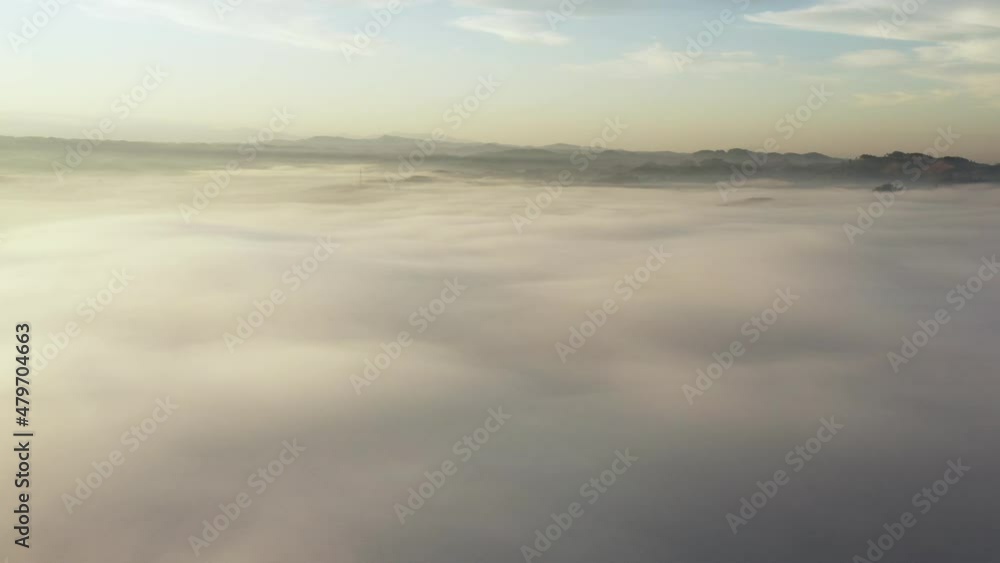 Aerial view of the rising sun from the mountains in the morning. Beautiful clouds. Aerial view of the rising sun from the mountains in the morning. Beautiful clouds.