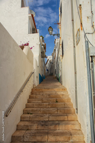 Narrow pedestrian street in old town of Albufeira city