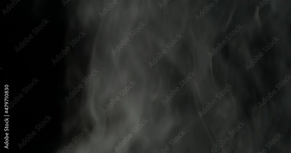 Realistic atmospheric gray smoke on black background. White fume slowly floating rises up.
Realistic atmospheric gray smoke on black background. White fume slowly floating rises up.