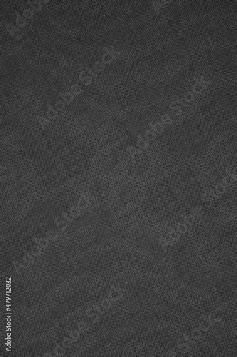 Seamless dark gray textile texture background of woven fabric cloth