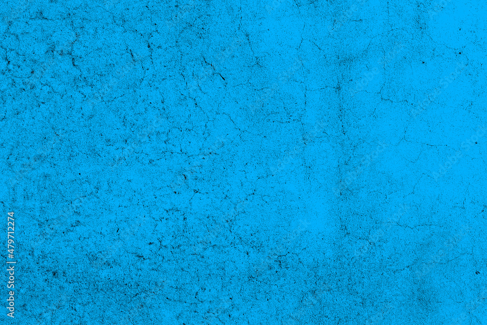 Blue color grungy crack textured background of cement plaster wall