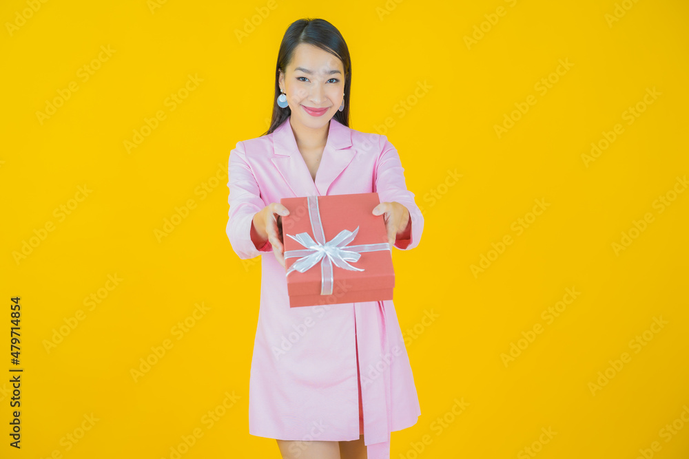 Portrait beautiful young asian woman smile with red gift box Portrait beautiful young asian woman smile with red gift box
