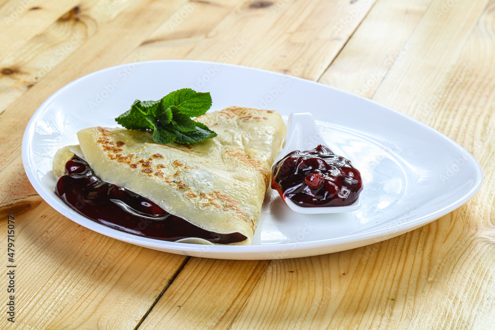 Delicous pancake with fruit jam