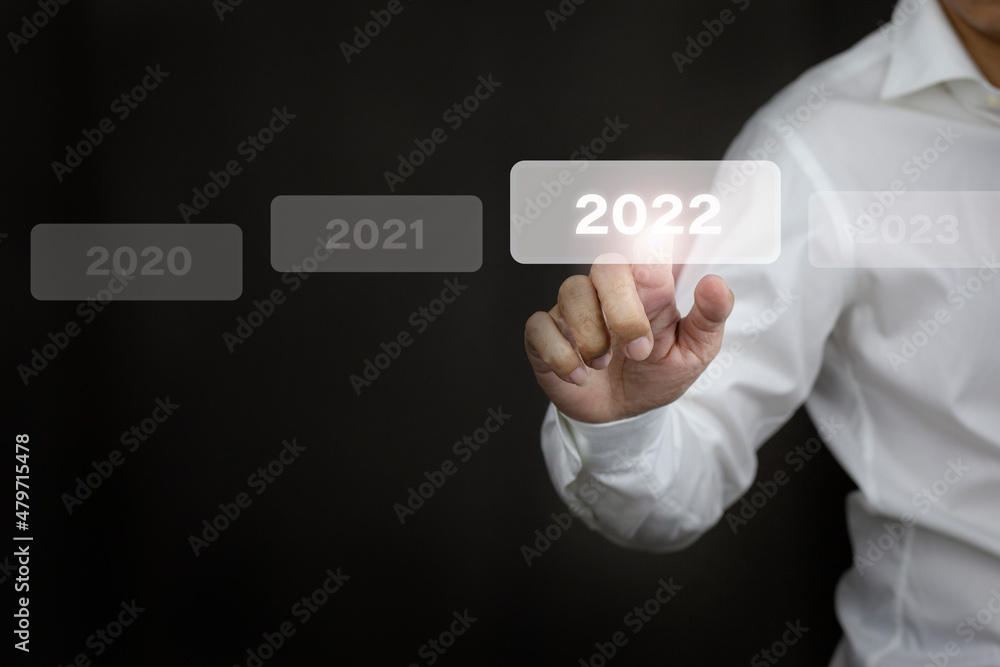 Businessman hands touch on white 2022 virtual screen, new year concept. Businessman hands touch on white 2022 virtual screen, new year concept.