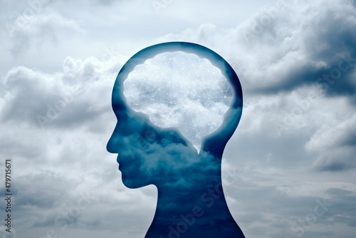 Brain circuitry and mind concept. Person head silhouette and cloudy sky.