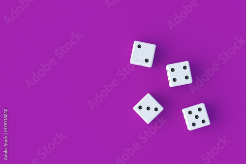 Board games. Addiction to gambling. Casino games. Random winnings. Jackpot. Leisure entertainment for the whole family. Dices on violet background. Top view. Copy space. 3d render