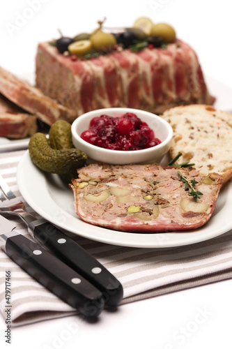Portion of Traditional French terrine covered with bacon isolated on white background