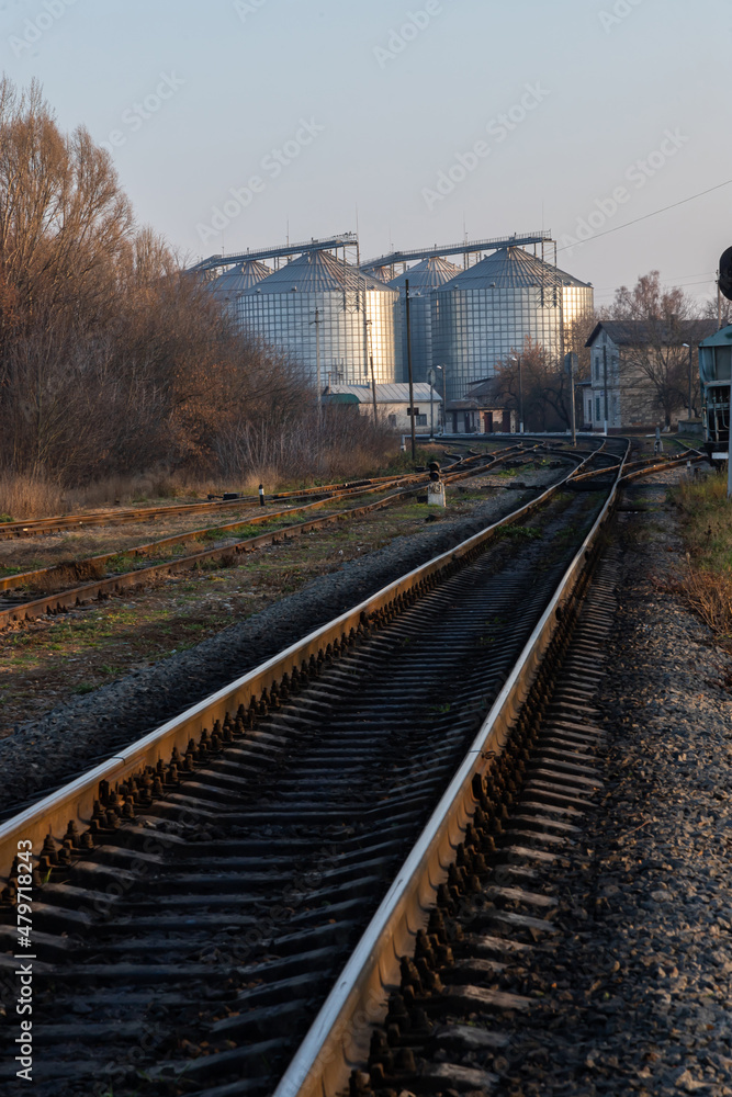 railway track near the factory. Autumn trees and factory premises railway track near the factory. Autumn trees and factory premises