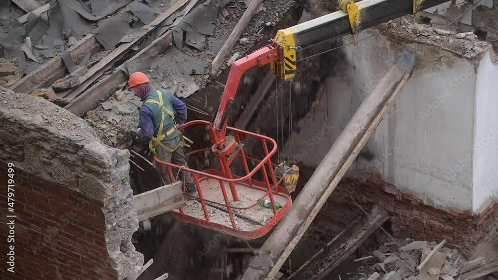 Demolition Using Wire Ropes Video Stock Demolition of old abandoned house, workman in orange helmet ...