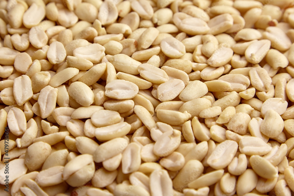 Raw blanched peanuts as food background Raw blanched peanuts as food background
