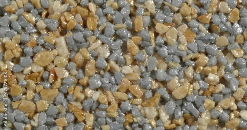 Close-up texture of fine marble chips. Grey and sand color. Close-up texture of fine marble chips. Grey and sand color.