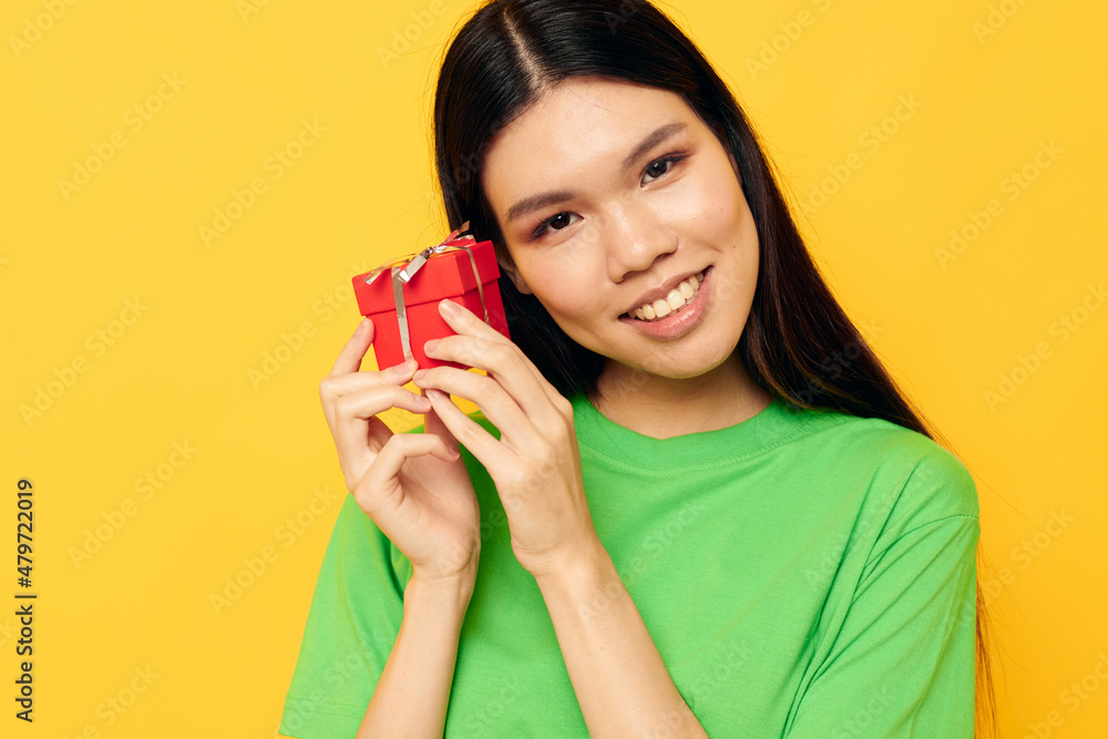 Charming young Asian woman Red gift box happy Birthday isolated background unaltered Charming young Asian woman Red gift box happy Birthday isolated background unaltered