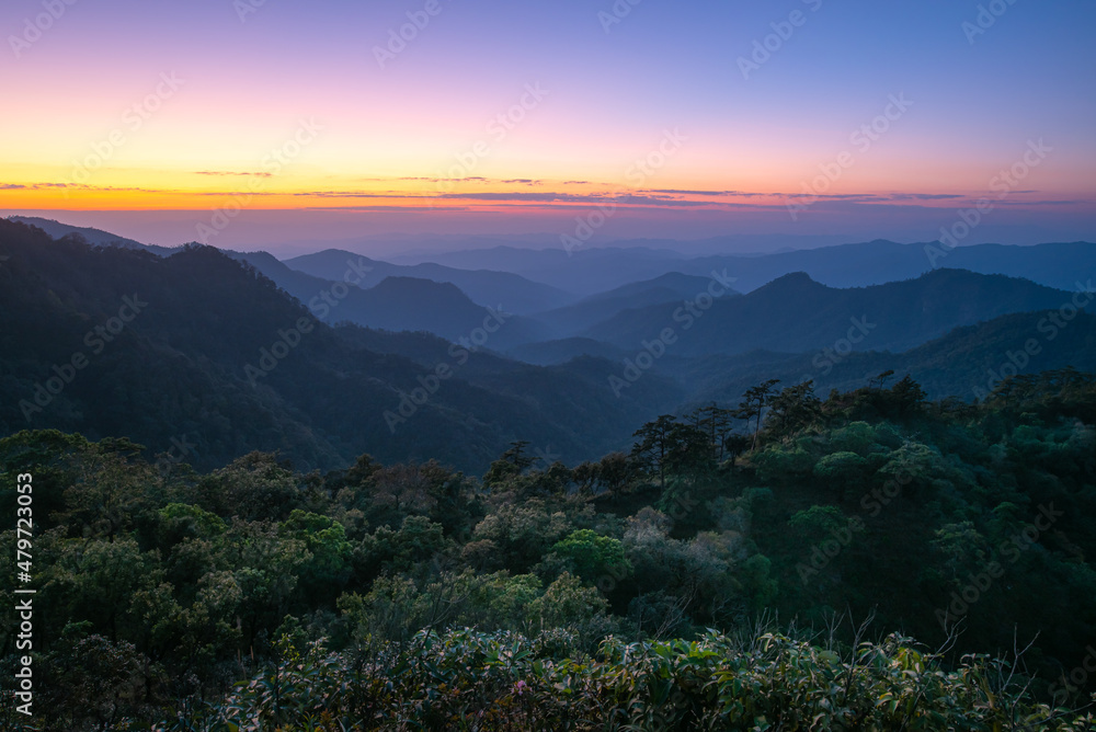 Sunset over the mountain range with colorful sky and amazing landscape on Doi Langka Luang 2,031 metres (6,660 ft) at Khun Chae National Park locate in Amper. Wiangpapao , Chaingrai district Thailand.