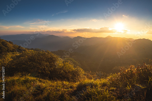 Sunset over the mountain range with colorful sky and amazing landscape on Doi Langka Luang 2,031 metres (6,660 ft) at Khun Chae National Park locate in Amper. Wiangpapao , Chaingrai district Thailand. photo