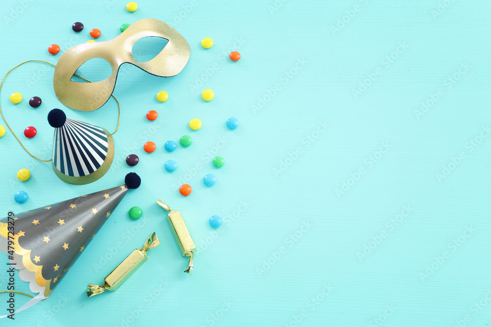 Party colorful image over blue background . Top view, flat lay Party colorful image over blue background . Top view, flat lay