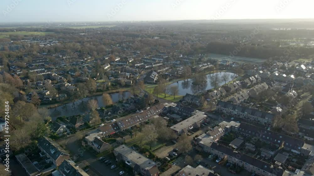 Aerial overview of beautiful town in the Netherlands with ponds and some traffic on the roads Aerial overview of beautiful town in the Netherlands with ponds and some traffic on the roads