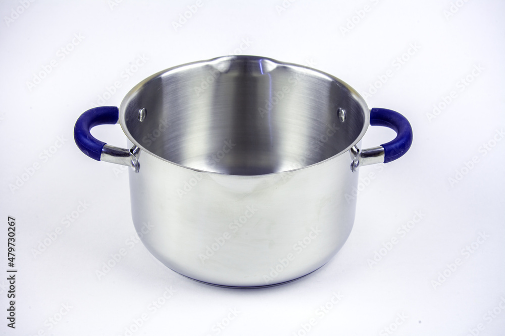 Metal saucepan with a glass lid for cooking soup, food. made of stainless steel. kitchen utensils with a thick bottom for electric, infrared, induction or gas stoves. On an isolated white background. Metal saucepan with a glass lid for cooking soup, food. made of stainless steel. kitchen utensils with a thick bottom for electric, infrared, induction or gas stoves. On an isolated white background.